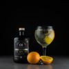 The Gin To My Tonic No.1 Yuzu & Szechuan Pepper Gin with perfect serve and garnish on black background