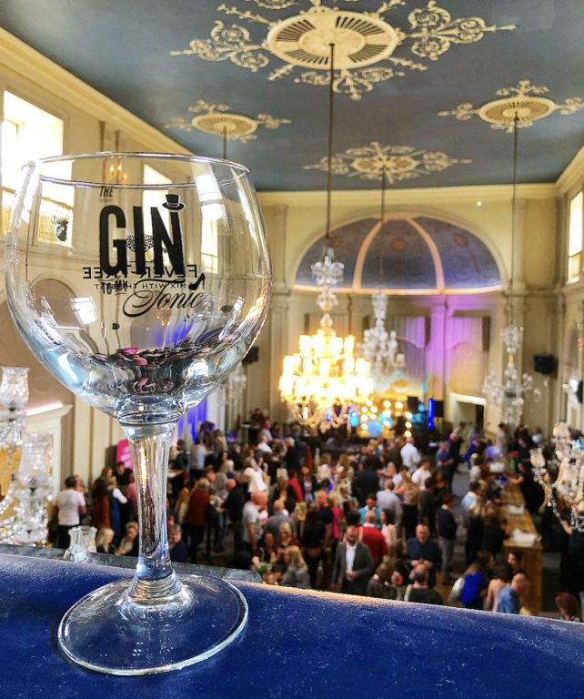 The Gin To My Tonic Branded Gin Copa Glass at a gin festival with people in the background