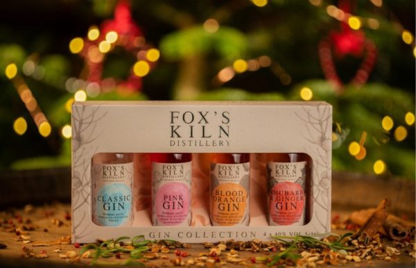 Fox’s Kiln Distillery Miniature Gin Gift Set in front of a christmas tree out of focus